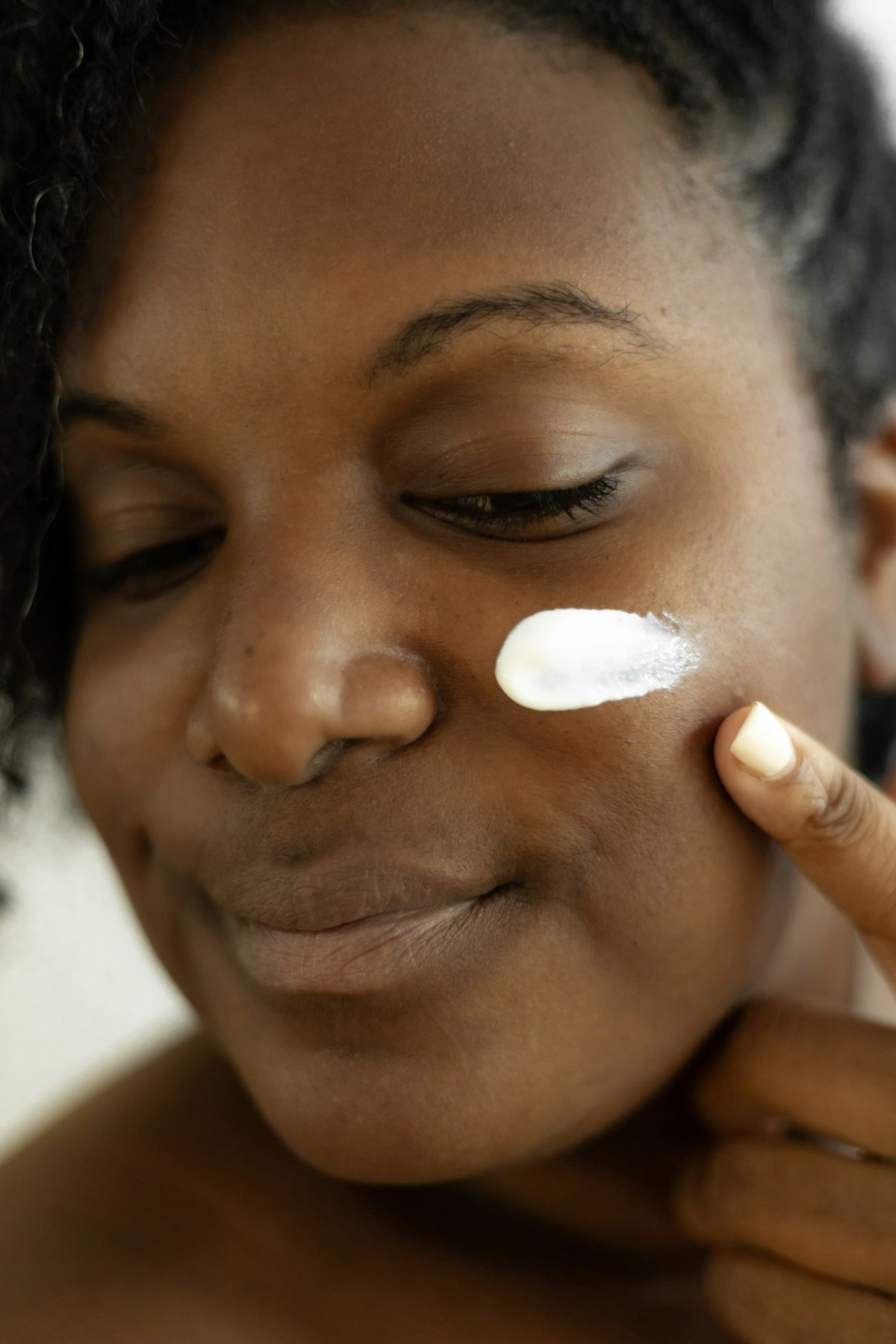 A bespoke facial moment - hydrating cream applied with care